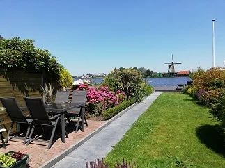 garden with river and windmill view